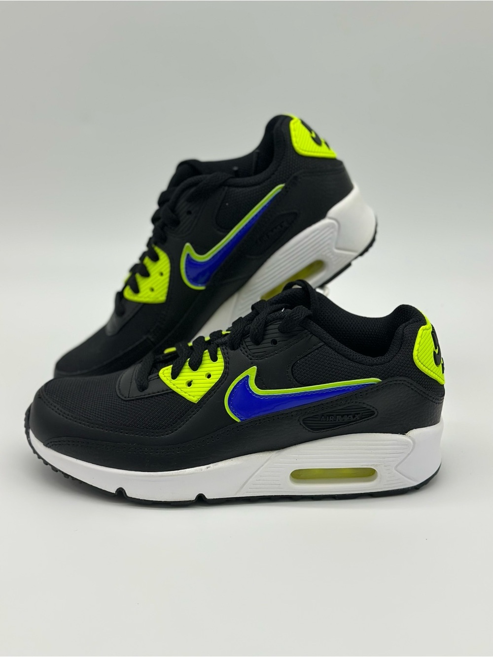 Nike Kids Black Sneakers with Neon Yellow and Blue Swoosh